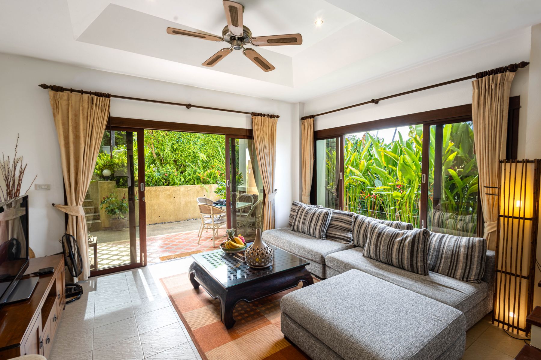 Villa living room opening onto the garden