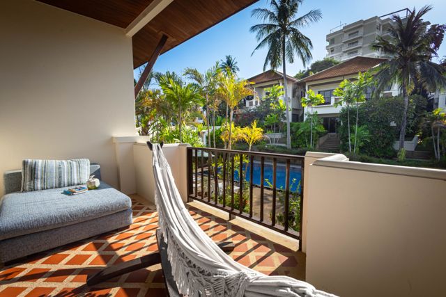 Balcony with hammock and pool view