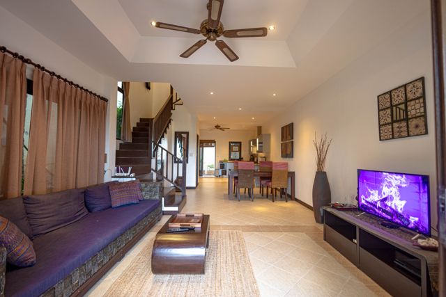 Living area with TV and dining table